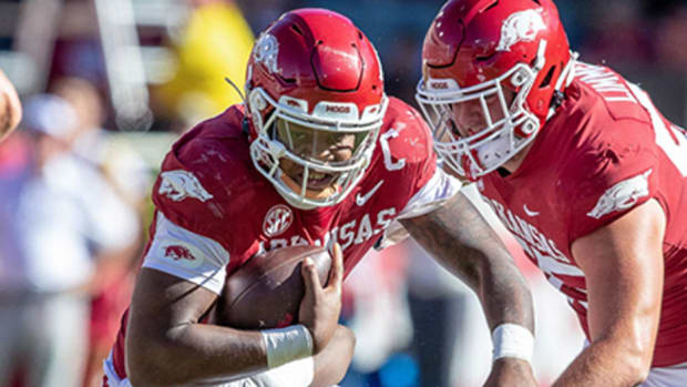 Arkansas Razorbacks quarterback KJ Jefferson tucks the ball and takes off running in Saturday's 49-26 loss to the Alabama Crimson Tide at Razorback Stadium in Fayetteville, Ark.
